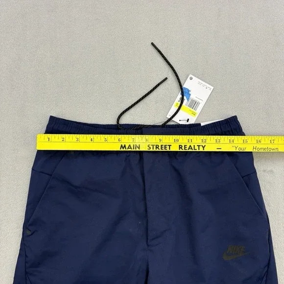 Nike Pants Mens Small Navy Sportswear Tech Essentials Commuter Woven Tapered Zip